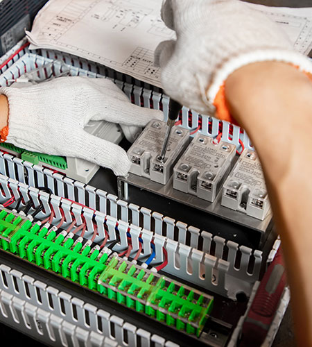 A worker is assembling a packaging machine