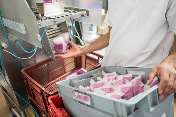 People working at a food factory making dairy products food industry concepts