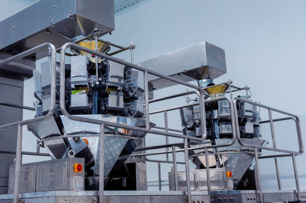 Vertical multi head weigher packaging machine snacks and chips in a factory.